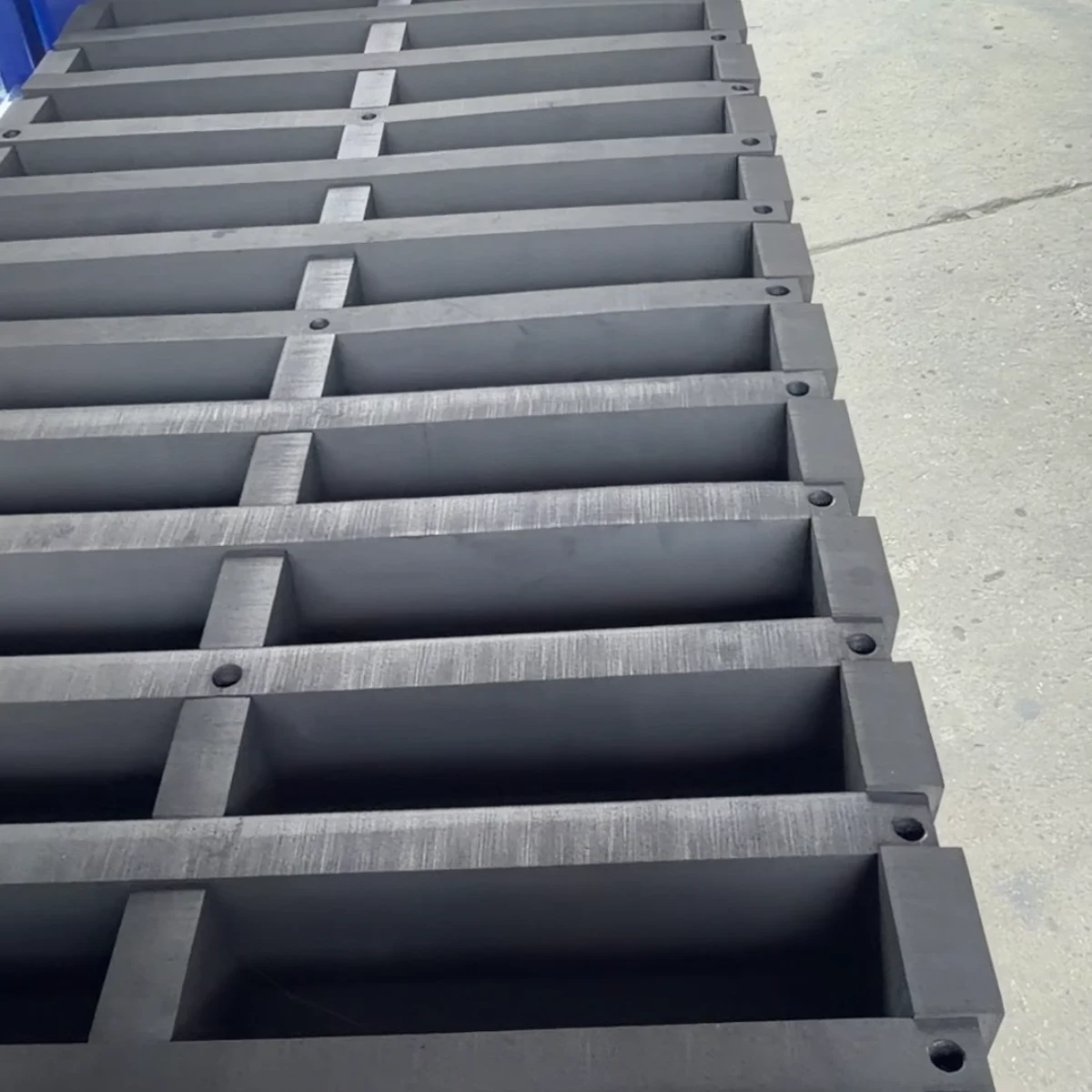 Real product photo of a gas strut tilting tray rack with gas-strut-assisted tilting trays and foam locators — configuration view 3