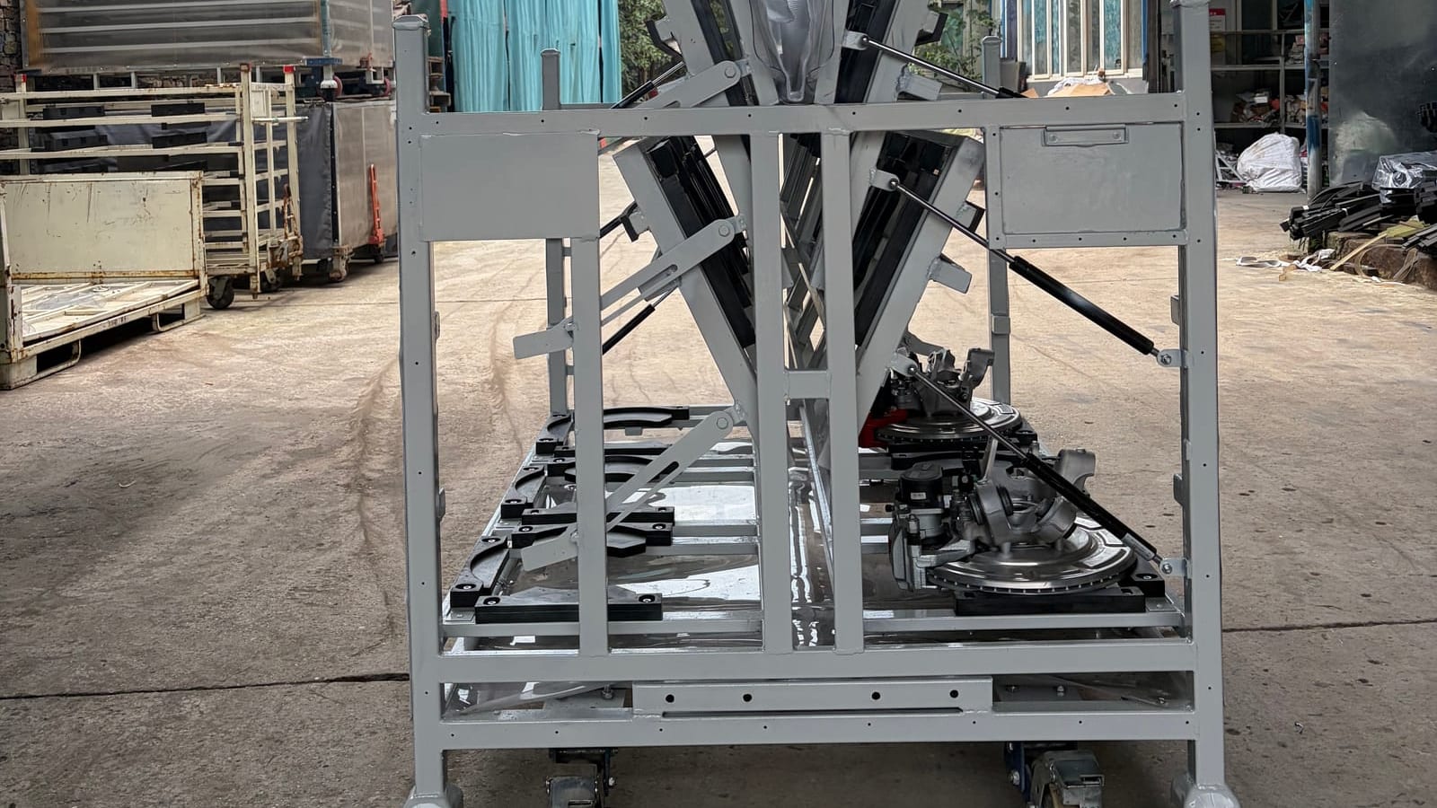 Steel stillage on casters holding automotive parts