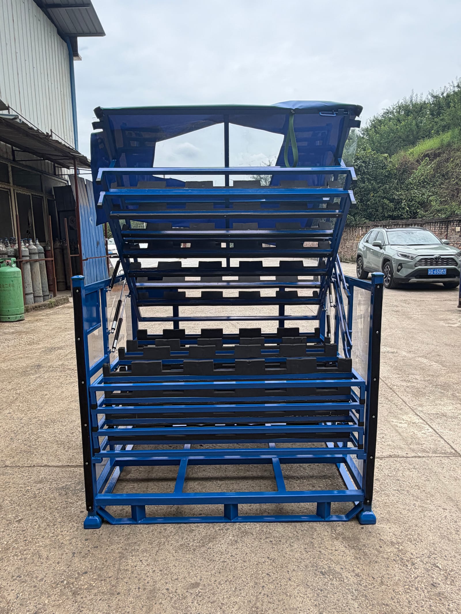 Real multi-level automotive rack with open loading access and part-specific support locations